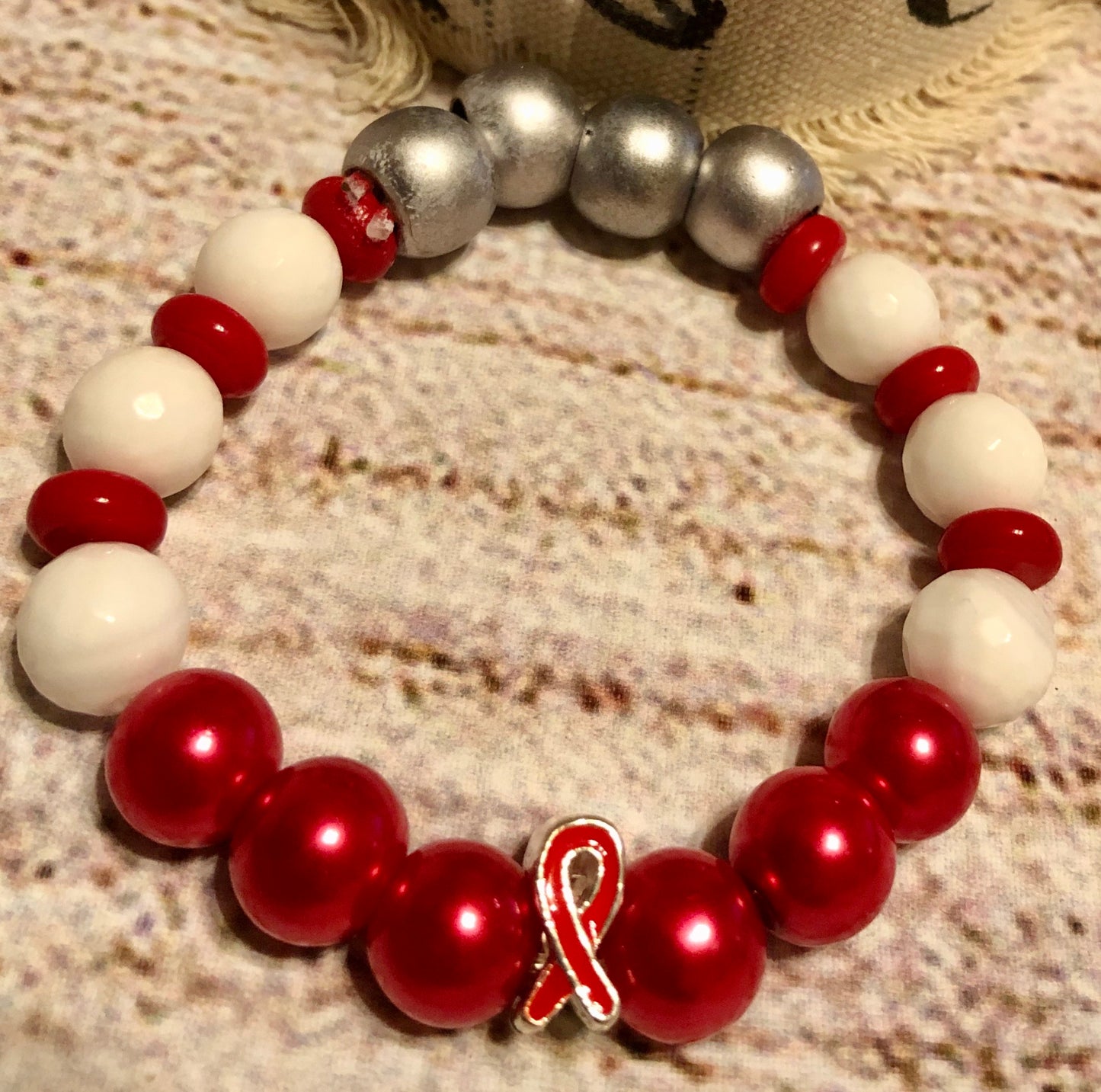 Red Awareness bracelet with white quartz